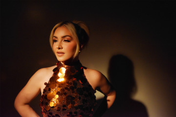 Maggie Rose in a gold sequined halter top, photographed for her Half Moon album release