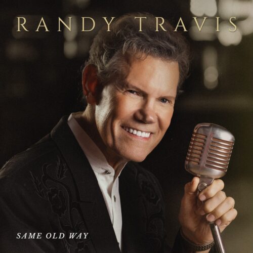 Randy Travis holding a vintage microphone on the Same Old Way album cover.